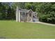 Two-story home featuring brick and vinyl siding, blue shutters, and an attached two-car garage at 96 Ashtonbrook Dr, Mcdonough, GA 30252