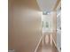 Hallway featuring wood floors, large front door, and a window at the end of the hall at 96 Ashtonbrook Dr, Mcdonough, GA 30252