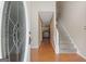 Inviting foyer with gleaming hardwood floors and a staircase leading to the upper level at 96 Ashtonbrook Dr, Mcdonough, GA 30252