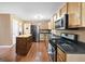 Bright kitchen with stainless steel appliances and a portable center island at 96 Ashtonbrook Dr, Mcdonough, GA 30252