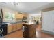 Well-lit kitchen featuring a center island, wood cabinets, and modern appliances at 96 Ashtonbrook Dr, Mcdonough, GA 30252