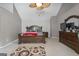 Primary bedroom with ample space, a ceiling fan, and a sitting area at 96 Ashtonbrook Dr, Mcdonough, GA 30252