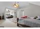 Spacious main bedroom featuring a ceiling fan and an connected area with a second bed at 96 Ashtonbrook Dr, Mcdonough, GA 30252