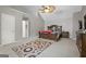 Spacious primary bedroom featuring a ceiling fan and large windows at 96 Ashtonbrook Dr, Mcdonough, GA 30252