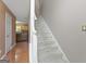 Carpeted staircase leading to the upper level of the home at 96 Ashtonbrook Dr, Mcdonough, GA 30252