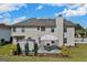 Backyard view with patio, outbuilding and landscaped ground at 1441 Saint George Pl, Conyers, GA 30012