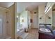 Bright bathroom features a shower, bathtub, double vanity, and plenty of storage space for a comfortable experience at 1441 Saint George Pl, Conyers, GA 30012