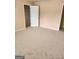 Spacious carpeted bedroom with neutral walls and ample closet space at 1441 Saint George Pl, Conyers, GA 30012