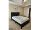 Comfortable bedroom featuring a tray ceiling, ceiling fan, and neutral walls at 1441 Saint George Pl, Conyers, GA 30012