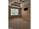 Bright bedroom with neutral walls, tray ceiling, ceiling fan, and natural light at 1441 Saint George Pl, Conyers, GA 30012