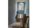 Two-story foyer with window above the front door with staircase and blue walls at 1441 Saint George Pl, Conyers, GA 30012
