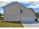 This home features a convenient two car garage with a clean and simple design at 1441 Saint George Pl, Conyers, GA 30012
