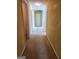Hallway with yellow walls, white trim, doors on either side, and beige carpeting at 1441 Saint George Pl, Conyers, GA 30012
