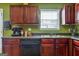 Efficient kitchen layout with plenty of counter space, storage, and essential appliances for modern living at 1441 Saint George Pl, Conyers, GA 30012
