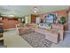 Cozy living room with a sectional sofa, colorful pillows, and an decorative rug at 1441 Saint George Pl, Conyers, GA 30012