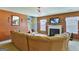 Comfortable living room with a fireplace, TV, large sectional sofa, and lots of natural light at 1441 Saint George Pl, Conyers, GA 30012