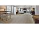 Expansive primary bedroom with ample space, fireplace, and ceiling fan creating a relaxing retreat at 1441 Saint George Pl, Conyers, GA 30012