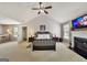 Bright bedroom with a vaulted ceiling, fireplace, and ceiling fan creating a relaxing retreat at 1441 Saint George Pl, Conyers, GA 30012