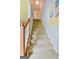 Carpeted stairway with handrail, providing a safe and comfortable passage to the upper level of the home at 1441 Saint George Pl, Conyers, GA 30012