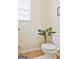 Toilet area with tan flooring, offering a functional and clean space at 1441 Saint George Pl, Conyers, GA 30012