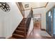 Lovely foyer featuring wood flooring, a decorative staircase, and views of the dining room at 1627 Leguin Mill Rd, Locust Grove, GA 30248