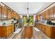 Traditional kitchen with wood cabinets, granite countertops, and a kitchen island at 1627 Leguin Mill Rd, Locust Grove, GA 30248