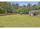 Large, well-maintained backyard with room to play and mature trees at 465 Crabapple Rd, Fayetteville, GA 30215
