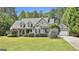 Charming home with a well-manicured lawn, dormer windows, and a welcoming facade exudes curb appeal at 465 Crabapple Rd, Fayetteville, GA 30215