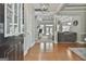 Bright foyer with hardwood floors seamlessly connects to the living room and kitchen at 465 Crabapple Rd, Fayetteville, GA 30215