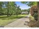 Beautiful home with mature trees and a long driveway at 465 Crabapple Rd, Fayetteville, GA 30215