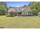 Charming exterior view of this lovely home with a manicured lawn and garden at 465 Crabapple Rd, Fayetteville, GA 30215