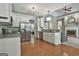 Spacious kitchen boasts stainless steel appliances, white cabinets, and an open layout connecting to living areas at 465 Crabapple Rd, Fayetteville, GA 30215