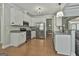 This kitchen features stainless steel appliances, granite countertops, a breakfast bar, and ample storage space at 465 Crabapple Rd, Fayetteville, GA 30215