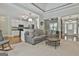 This open-concept living room includes a fireplace, kitchen view, and a seamless transition to other living areas at 465 Crabapple Rd, Fayetteville, GA 30215
