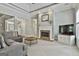 Inviting living room featuring a fireplace, plush seating, and stylish decor enhances the cozy ambiance at 465 Crabapple Rd, Fayetteville, GA 30215