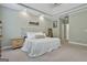 Spacious main bedroom boasts a decorative headboard, soft carpeting, and neutral color scheme at 465 Crabapple Rd, Fayetteville, GA 30215