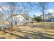 Expansive backyard with lush green lawn and a deck perfect for outdoor entertaining and relaxation at 2511 Due West Nw Cir, Kennesaw, GA 30152