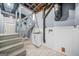 Finished basement with laundry sink, stairs and tiled floors at 2511 Due West Nw Cir, Kennesaw, GA 30152