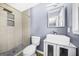 Updated bathroom with a tiled shower, unique sink, vanity, and modern fixtures at 2511 Due West Nw Cir, Kennesaw, GA 30152