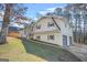 Charming two-story home with a two-car garage and a well-maintained lawn on a sunny day at 2511 Due West Nw Cir, Kennesaw, GA 30152
