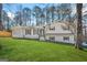 Charming two-story home with a well-manicured lawn and mature trees offers excellent curb appeal at 2511 Due West Nw Cir, Kennesaw, GA 30152