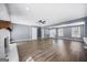 Open living room area featuring a brick fireplace and hardwood flooring throughout the home at 2511 Due West Nw Cir, Kennesaw, GA 30152