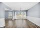 Bright living room featuring a bay window, neutral paint, and hardwood floors throughout at 2511 Due West Nw Cir, Kennesaw, GA 30152