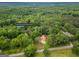 Aerial view of property at 428 Cornish Mountain Road, Oxford, Georgia, nestled among lush greenery at 428 Cornish Mountain Rd, Oxford, GA 30054
