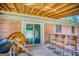 Inviting covered back porch with wood flooring perfect for outdoor relaxing at 428 Cornish Mountain Rd, Oxford, GA 30054