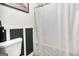 Updated bathroom with modern decor and white shower curtain in a well-lit space at 428 Cornish Mountain Rd, Oxford, GA 30054
