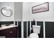 Nicely remodeled bathroom featuring half wall wainscoting and modern sink with granite countertop at 428 Cornish Mountain Rd, Oxford, GA 30054