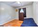 Bedroom featuring hardwood floors, neutral walls, and a built in dresser at 428 Cornish Mountain Rd, Oxford, GA 30054