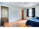 Bedroom with hardwood floors, two windows, and a view of an adjoining room at 428 Cornish Mountain Rd, Oxford, GA 30054