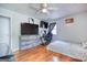 Bedroom with hard wood floor and tv at 428 Cornish Mountain Rd, Oxford, GA 30054